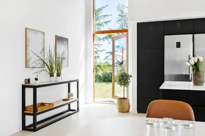 a kitchen with a black wall and a table at BL1491-Saltum-Laustvej-10 in Saltum