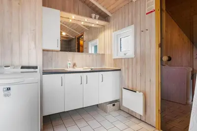 a kitchen with white cabinets and a sink at BL177-Saltum-Kvansletten-23 in Saltum