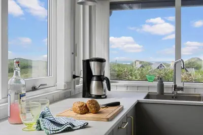 a kitchen with a counter with a coffee maker and a window at BL832-Saltum-Kohlsvej-8 in Saltum