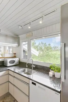 a kitchen with a sink and a window at BL1418-Blokhus-Malinsvej-14 in Blokhus