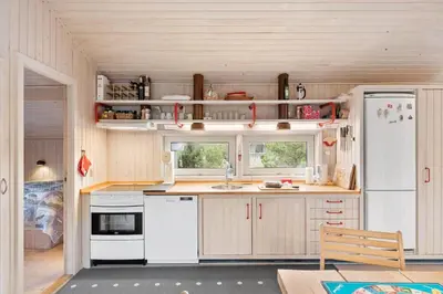 a kitchen with white appliances and a white refrigerator at BL1263-Saltum-Ornebjergvej-25 in Saltum