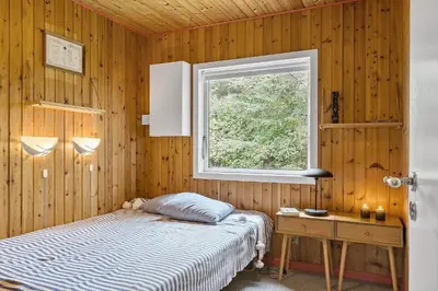 a bedroom with a bed and a desk and a window at BL1494-Saltum-Viborgvej-6 in Saltum