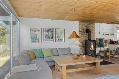 a living room with a couch and a table at BL1677-Saltum-Sikahjortvej-6 in Saltum