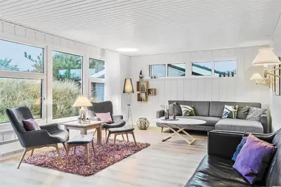 a living room with a couch and chairs and a table at BL1767-Saltum-Saltum-Strandvej-209 in Saltum