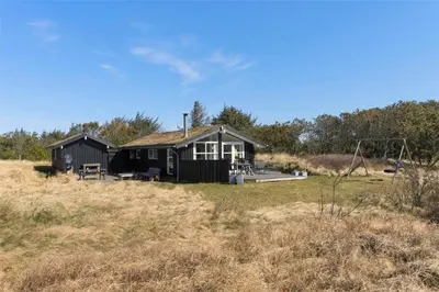 a small house in the middle of a field at BL418-Pandrup-Hunetorp-Klitvej-141 in Pandrup