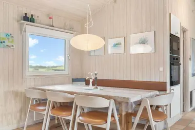 a kitchen with a dining room table and chairs at BL203-Saltum-Karen-Mariesvej-67 in Saltum