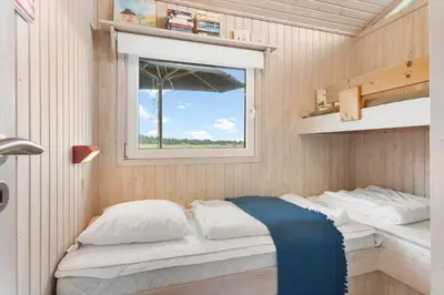 a small bedroom with a bed and a window at BL203-Saltum-Karen-Mariesvej-67 in Saltum