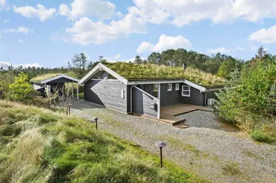 a house with a grass roof on top of it at BL1678-Pandrup-Hunetorp-Klitvej-1-B in Pandrup
