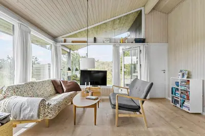 a living room with a couch and a table at BL1696-Saltum-Kordalslien-9 in Saltum