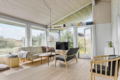 a living room with a couch and a tv at BL1696-Saltum-Kordalslien-9 in Saltum