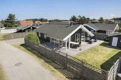 an aerial view of a house with a fence at BL791-Blokhus-Paa-Bakken-3 in Blokhus