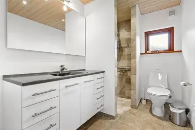 a white bathroom with a sink and a toilet at BL451-Saltum-Trehoje-14 in Saltum