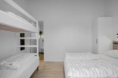 two beds in a white room with white walls at BL1257-Saltum-Vesterhavs-Sletten-35 in Saltum