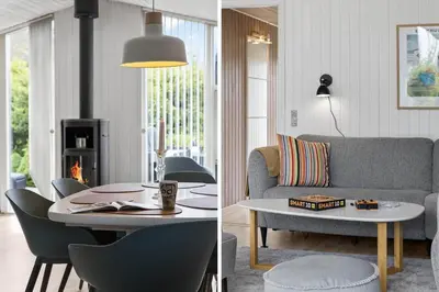 a living room with a couch and a table at BL1218-Blokhus-Quintusvej-24 in Blokhus