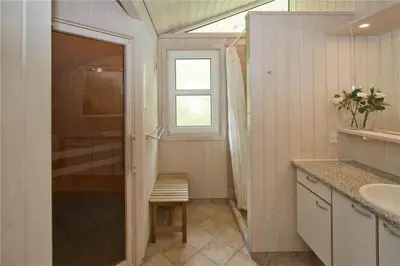 a bathroom with a shower and a sink and a window at BL178-Saltum-Ornebjergvej-16 in Saltum