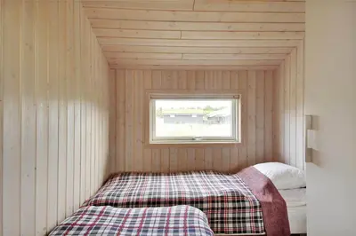 a small room with a bed and a window at BL1299-Saltum-Bondagervej-44 in Saltum