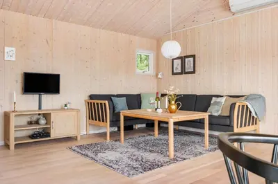 a living room with a couch and a table at BL1399-Saltum-Laustvej-30 in Saltum
