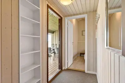 a door leading to a room with shelves at BL1311-Saltum-Kordalsvej-90 in Saltum