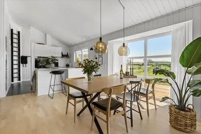 a kitchen and dining room with a table and chairs at BL479-Saltum-Laustvej-26 in Saltum
