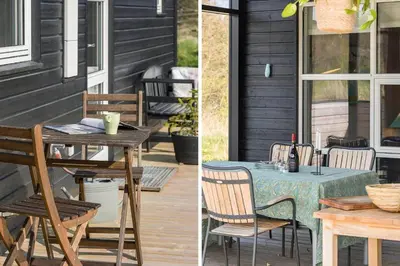a table and chairs sitting on a porch with a table at BL448-Saltum-Nordvestvej-1 in Saltum
