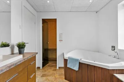 a large bathroom with a tub and a sink at BL854-Saltum-Porsevej-6-A in Saltum