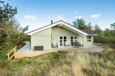 a small green house on a wooden deck at BL1233-Saltum-Krogsletten-14 in Saltum