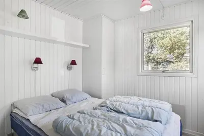 two beds in a white room with a window at BL1051-Pandrup-Rodhus-Skolevej-11 in Pandrup