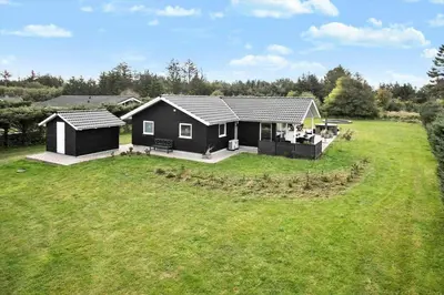 an aerial view of a house in a field at BL1785-Blokhus-Jaegerensvej-18 in Blokhus