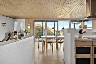 a kitchen and dining room with a table and chairs at BL678-Saltum-Lemmingvej-10 in Saltum