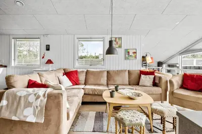 a living room with a couch and a table at BL1370-Saltum-Fladen-Grund-14 in Saltum