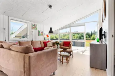 a living room with a large couch and a table at BL1370-Saltum-Fladen-Grund-14 in Saltum