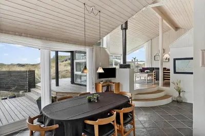 a dining room with a table and chairs at BL168-Saltum-Taarnfalkevej-11 in Saltum