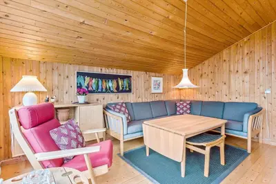 a living room with a couch and a table and chairs at BL1568-Saltum-P-Ejerstedgaardsvej-1-A in Saltum
