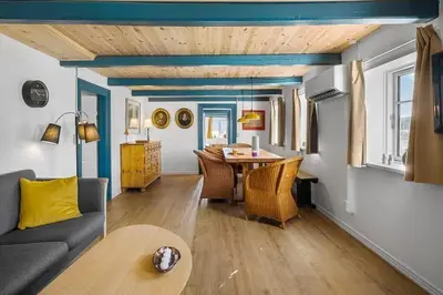 a living room with a couch and a table at BL1249-Pandrup-Rodhus-Klitvej-80 in Pandrup