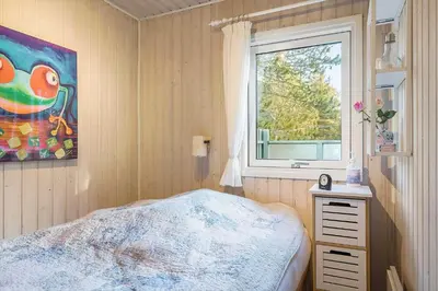 a bedroom with a bed and a window at BL1523-Saltum-Skanderborgvej-14 in Saltum