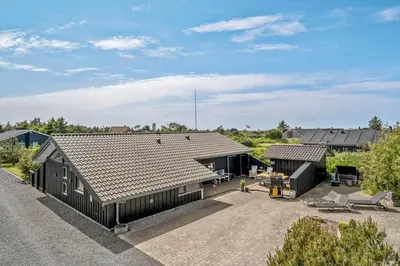 an aerial view of a house with a roof at BL1102-Blokhus-Solbakkevej-17 in Blokhus