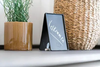 a tablet sitting on a shelf next to a plant at 336-Harboore-Hvilehjemsvej-23 in Harboør
