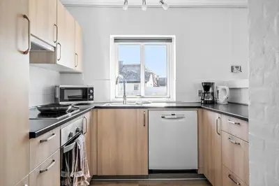 a kitchen with a sink and a microwave at 159-Harboore-Alkajavej-6 in Harboør