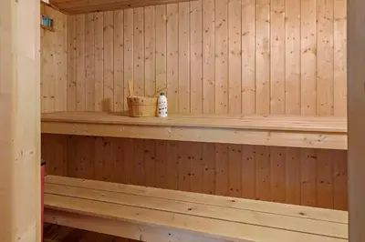 a wooden sauna with a shelf in it at 286-Harboore-Neerlandiavej-198 in Harboør