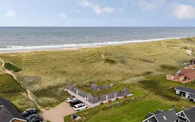 an aerial view of a house next to the ocean at 265-Harboore-Lucievej-6-b in Harboør