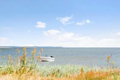 a boat sitting in the middle of the water at 600-Lemvig-Porsevej-115 in Lemvig