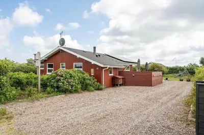 a red barn with a gravel driveway at 600-Lemvig-Porsevej-115 in Lemvig