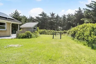 a yard with a basketball hoop in front of a house at 203-Harboore-Viktoriavej-3 in Harboør