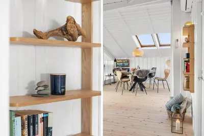a room with wooden shelves and a dining room at 254-Harboore-Vejlby-Klit-251 in Harboør