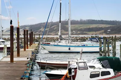 a group of boats are docked in a marina at G522-Lemvig-Vinkelhagevej-22 in Lemvig