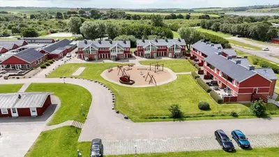 an aerial view of a home with a playground at G522-Lemvig-Vinkelhagevej-22 in Lemvig