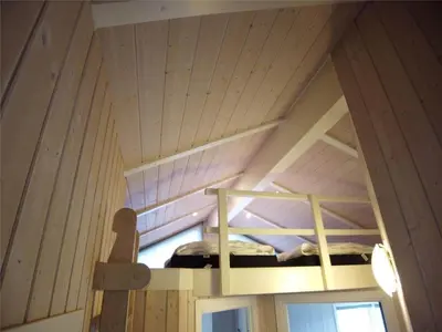 a room with two bunk beds in a cabin at 234-Harboore-Neerlandiavej-21 in Harboør