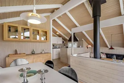 a kitchen with a table and chairs in a room at 205-Harboore-Doblervej-39 in Harboør