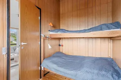 a room with two bunk beds on the wall at G398-Lemvig-Violvej-98 in Lemvig