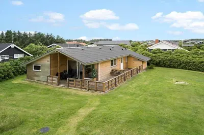 a small house with a large yard at 294-Harboore-Neerlandiavej-102 in Harboør